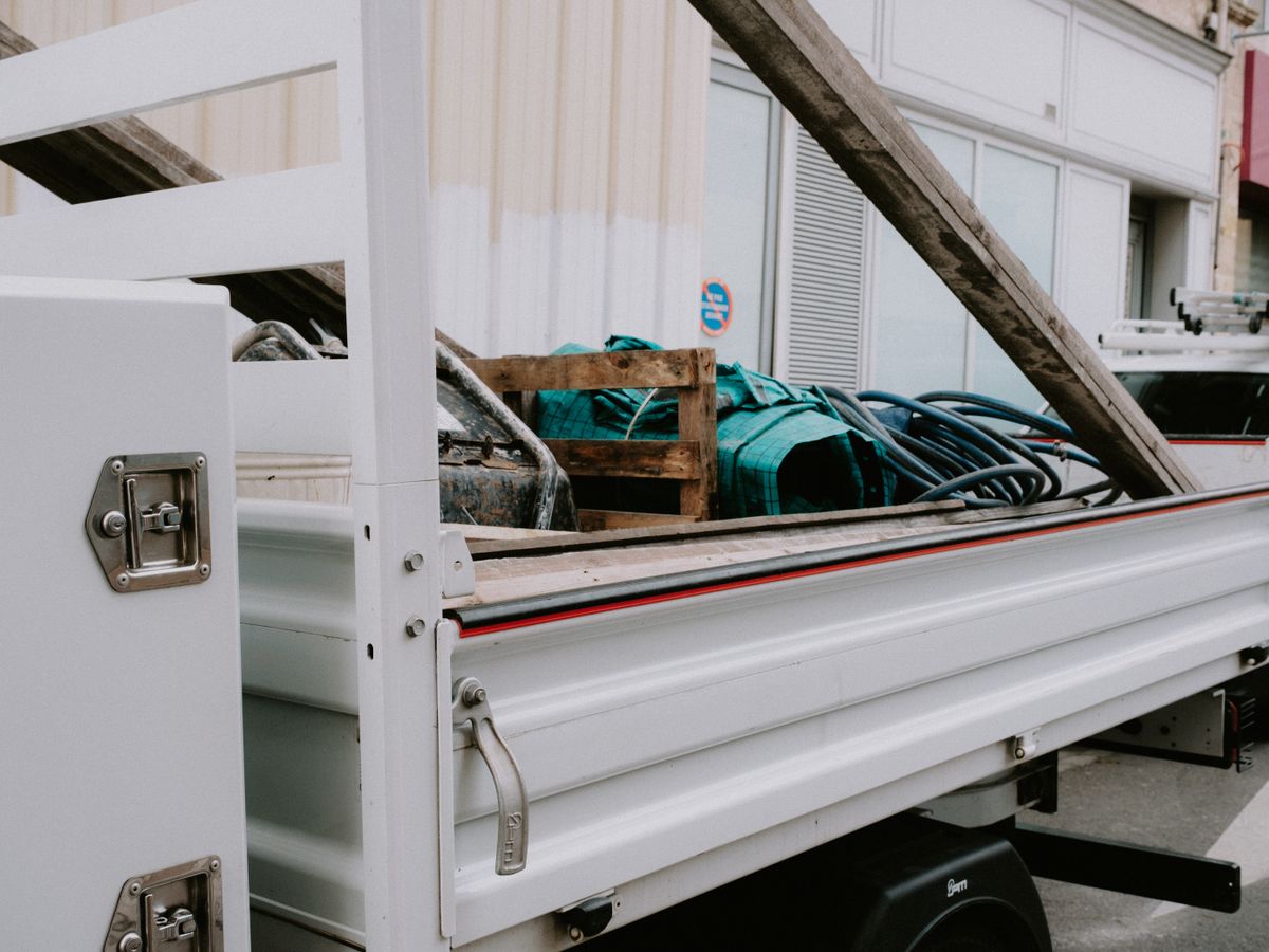 A utility trailer loaded with household items for disposal